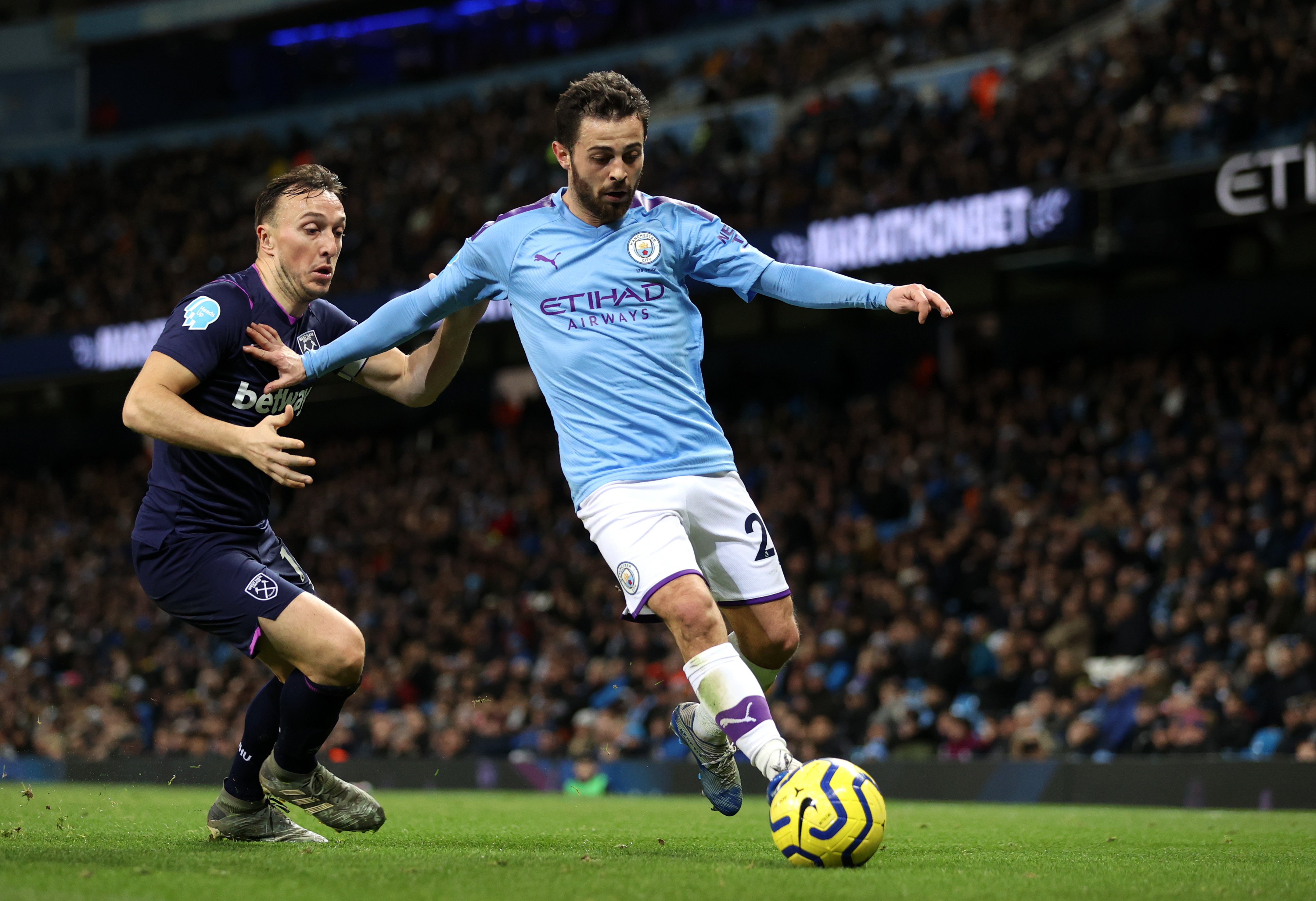 Bernardo Silva, junto a Mark Noble, del West Ham  (Photo by Clive Brunskill/Getty Images)