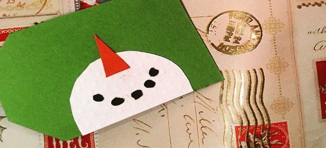 Una etiqueta de regalo de muñeco de nieve. 