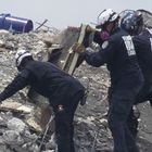 SURFSIDE, FLORIDA - JUNE 26: Members of the South Florida Urban Search and Rescue team look for possible survivors in the partially collapsed 12-story Champlain Towers South condo building on June 26, 2021 in Surfside, Florida. Over 150 people are being reported as missing as search-and-rescue efforts continue with rescue crews from across Miami-Dade and Broward counties. Joe Raedle/Getty Images/AFP
== FOR NEWSPAPERS, INTERNET, TELCOS & TELEVISION USE ONLY ==