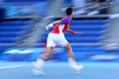 Tokyo 2020 Olympics - Tennis - Men's Singles - Bronze medal match - Ariake Tennis Park - Tokyo, Japan - July 31, 2021. Novak Djokovic of Serbia throws his racket into the stands during his bronze medal match against Pablo Carreno of Spain REUTERS/Edgar Su