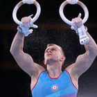 Ivan Tikhonov, of Azerbaijan, performs on the rings during the men's artistic gymnastic qualifications at the 2020 Summer Olympics, Saturday, July 24, 2021, in Tokyo. (AP Photo/Gregory Bull)