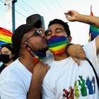 HERMOSILLO, MEXICO - JUNE 26: A couple kisses during a LGBT+ Pride parade on June 26, 2021 in Hermosillo, Mexico. (Photo by Luis Gutierrez/ Norte Photo/Getty Images)