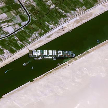 This satellite image from Cnes2021, Distribution Airbus DS, shows the cargo ship MV Ever Given stuck in the Suez Canal near Suez, Egypt, Thursday, March 25, 2021. The skyscraper-sized cargo ship wedged across Egypt's Suez Canal further imperiled global shipping Thursday as at least 150 other vessels needing to pass through the crucial waterway idled waiting for the obstruction to clear, authorities said. (Cnes2021, Distribution Airbus DS via AP)