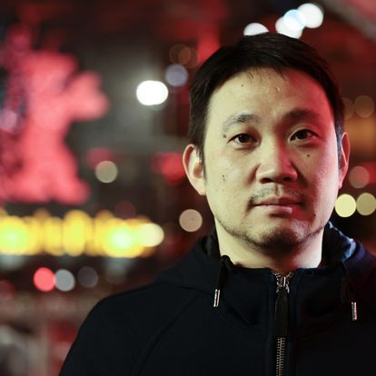 Ryusuke Hamaguchi a member of the jury of the International Film Festival Berlin 'Berlinale', poses for media on the eve of the festival's opening in Berlin, Germany, Wednesday, Feb. 9, 2022. (AP Photo/Hannibal Hanschke, Pool)