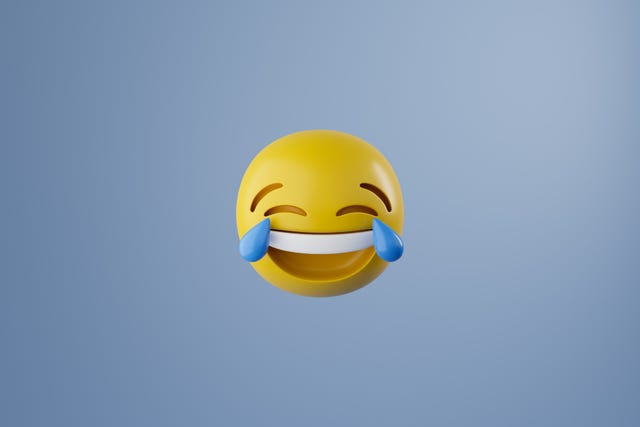 emoticono de cara sonriente con grandes lágrimas azules en los ojos