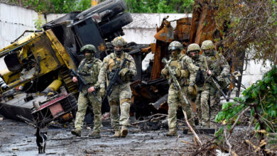 A photograph taken during a trip organized by the Russian Defense Ministry showing Russian soldiers in a destroyed part of a Mariupol factory on Wednesday.