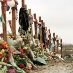 Ryan Foreman of Denver's South Metro Fire Department, visits a memorial for the victims of Columbine High School tragedy in Clement Park April 30, 1999.