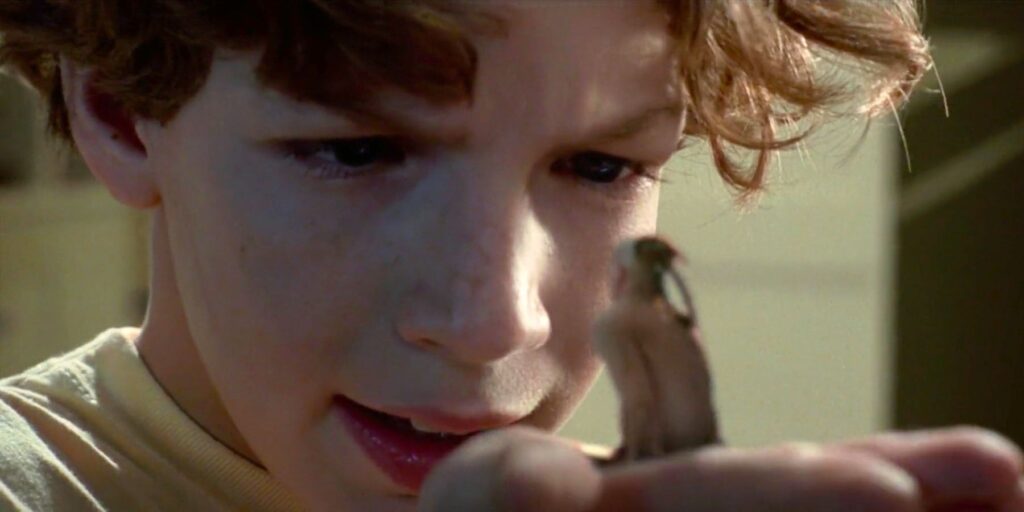 Omri looking down at Little Bear in The Indian in the Cupboard