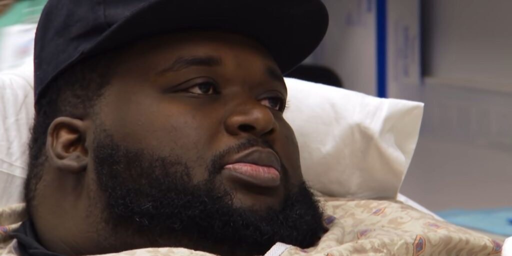 Thederick James My 600-Lb Life leaning back on pillow in bed