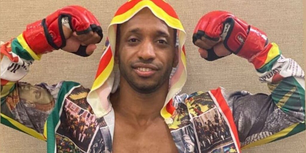 Biniyam Shibre from 90 Day Fiancé in boxing gear and arms up