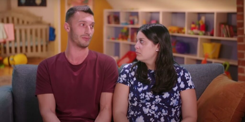 Loren & Alexei Brovarnik 90 day Fiance sitting on couch looking at each other