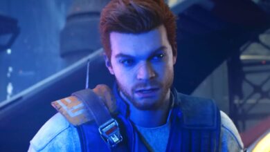 Cal Kestis in Star Wars Jedi: Survivor, illuminated by the blue light of his lightsaber.