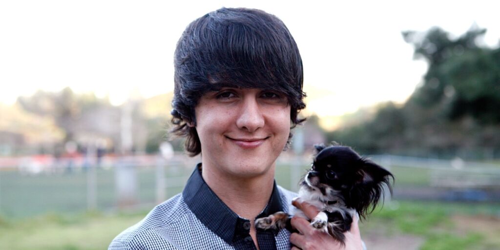 Million Dollar Listing LA's Chad Rogers holding a dog