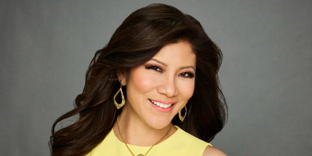 Julie Chen Moonves Big Brother smiling in a yellow dress