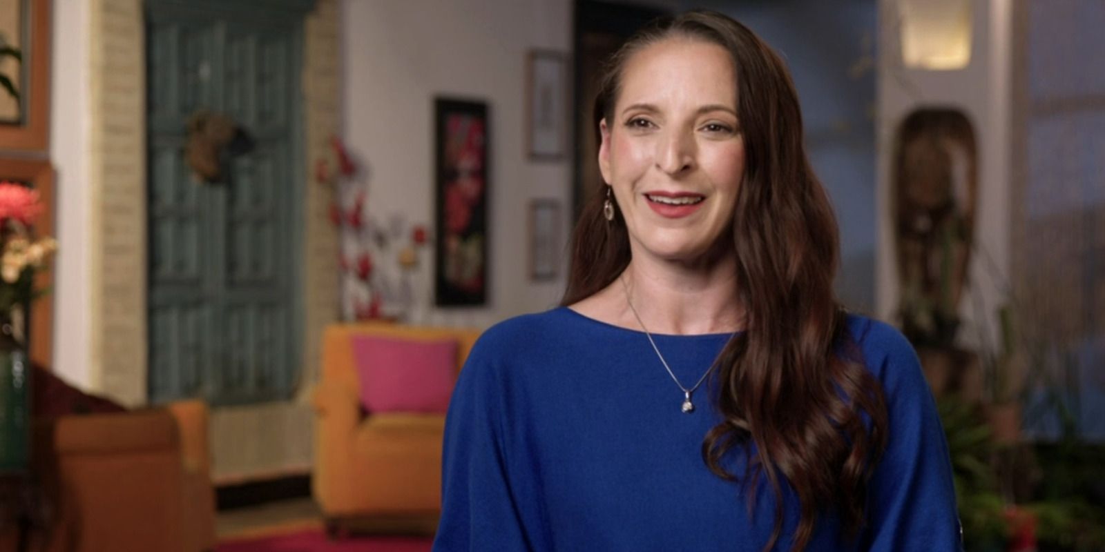 90 Day Fiancé: The Other Way Kris Foster wearing royal blue top smiling