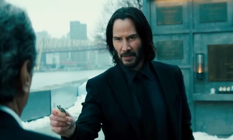 Keanu Reeves talking to Winston in John Wick 4.