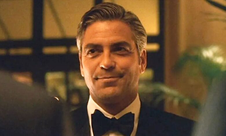 George Clooney smirking in Ocean's Eleven.