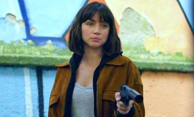 Ana de Armas pointing a gun in The Gray Man.