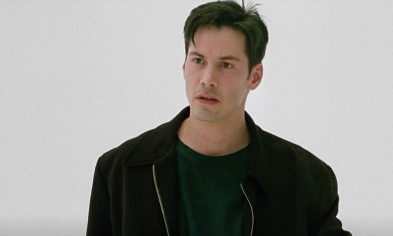 Keanu Reeves as Neo looking serious in The Matrix