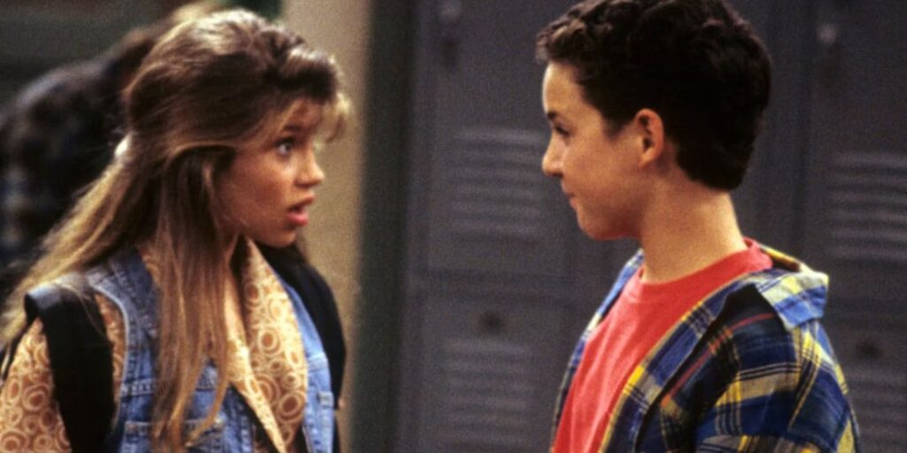 Topanga and Cory in Boy Meets World talking at school