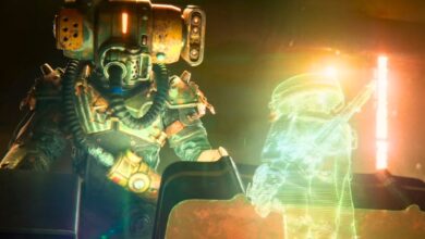 A large, helmeted character looking down onto a hologram projection of a smaller character in a dimly-lit setting in Meet Your Maker.