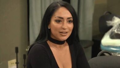 Jersey Shore's Angelina Pivarnick after entering house for first time wearing black outfit smiling