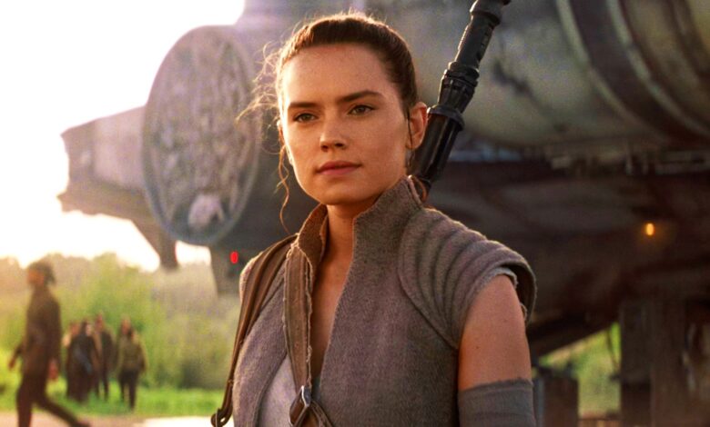Daisy Ridley as Rey in Star Wars The Force Awakens in front of Millennium Falcon.