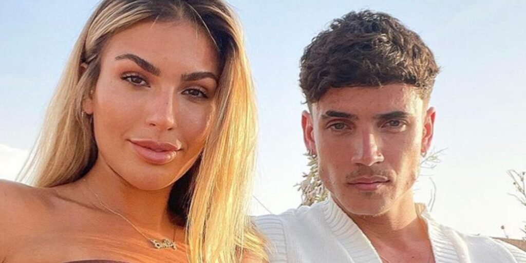 Cam Holmes and Emily Miller from Too Hot To Handle sitting outside together