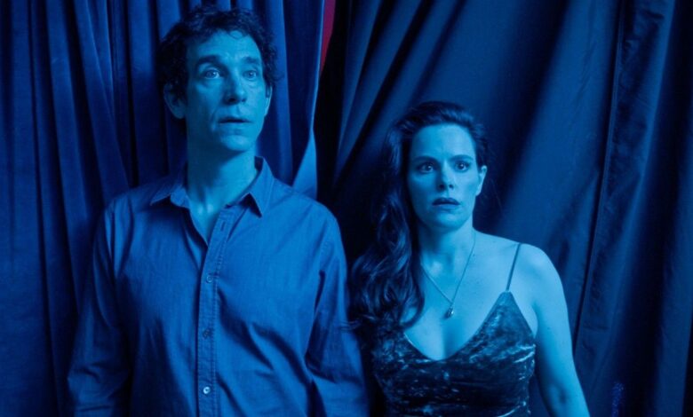 The couple from The End of Sex standing together looking flabbergasted.