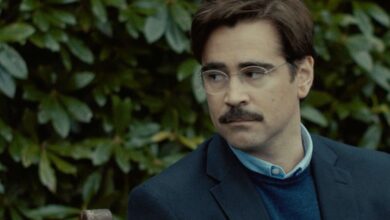 David looking to his right while standing in front of a green background in The Lobster.