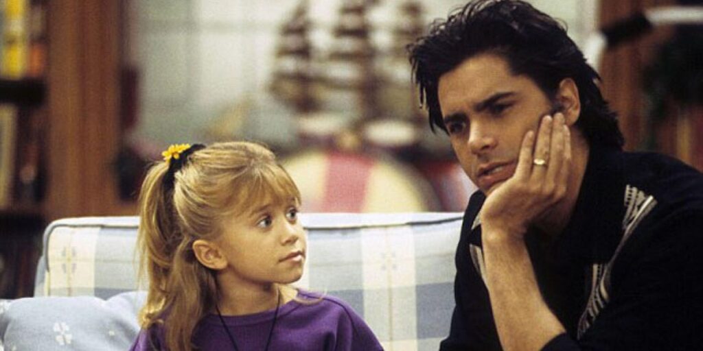 Michelle and Jesse talking to each other in the living room in Full House