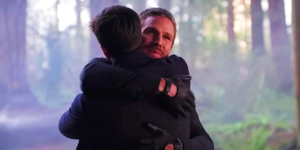 Stephen Amell as Oliver Queen Hugs Grant Gustin As Barry Allen in The Flash Season 9 Episode 9