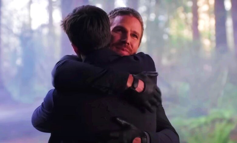 Stephen Amell as Oliver Queen Hugs Grant Gustin As Barry Allen in The Flash Season 9 Episode 9