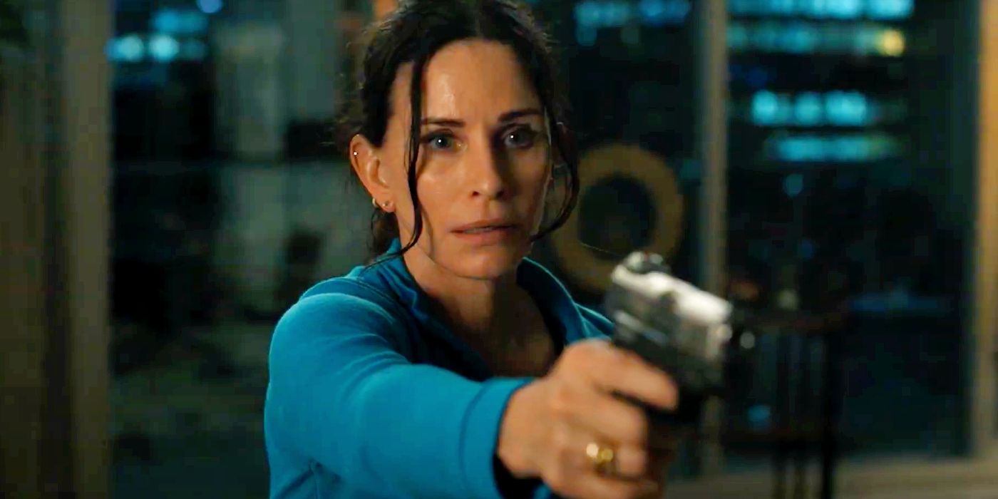 Courteney Cox holding a gun in Scream 6.