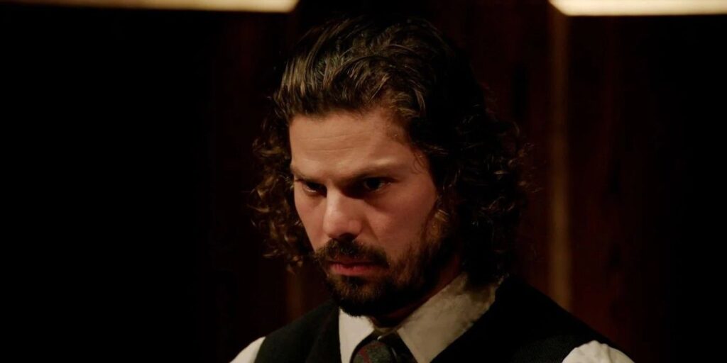 Christian de la Torre The Traitors looking down dark background