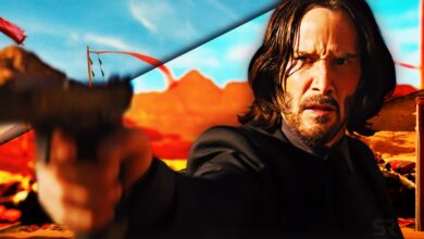 Keanu Reeves as John Wick pointing a gun at someone