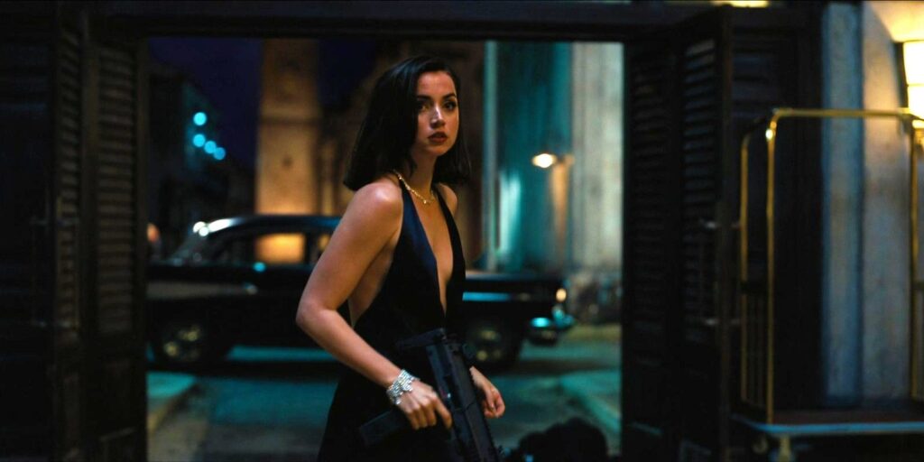 Ana de Armas as Paloma holding a gun in her hand in No Time To Die
