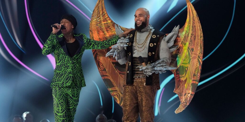 Nick Cannon unmasking Keenan Allen on The Masked Singer