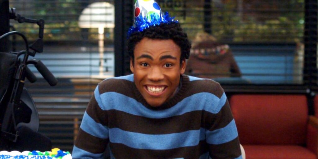 Donald Glover smiling as Troy in Community.