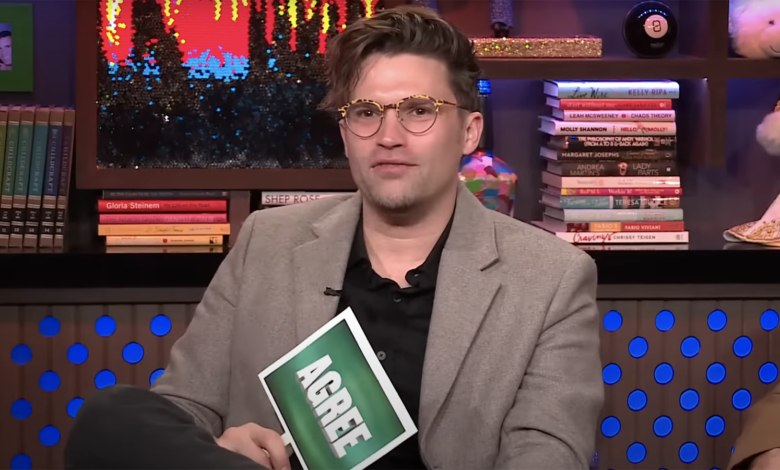 Tom Schwartz from Vanderpump Rules on Watch What Happens Live holding