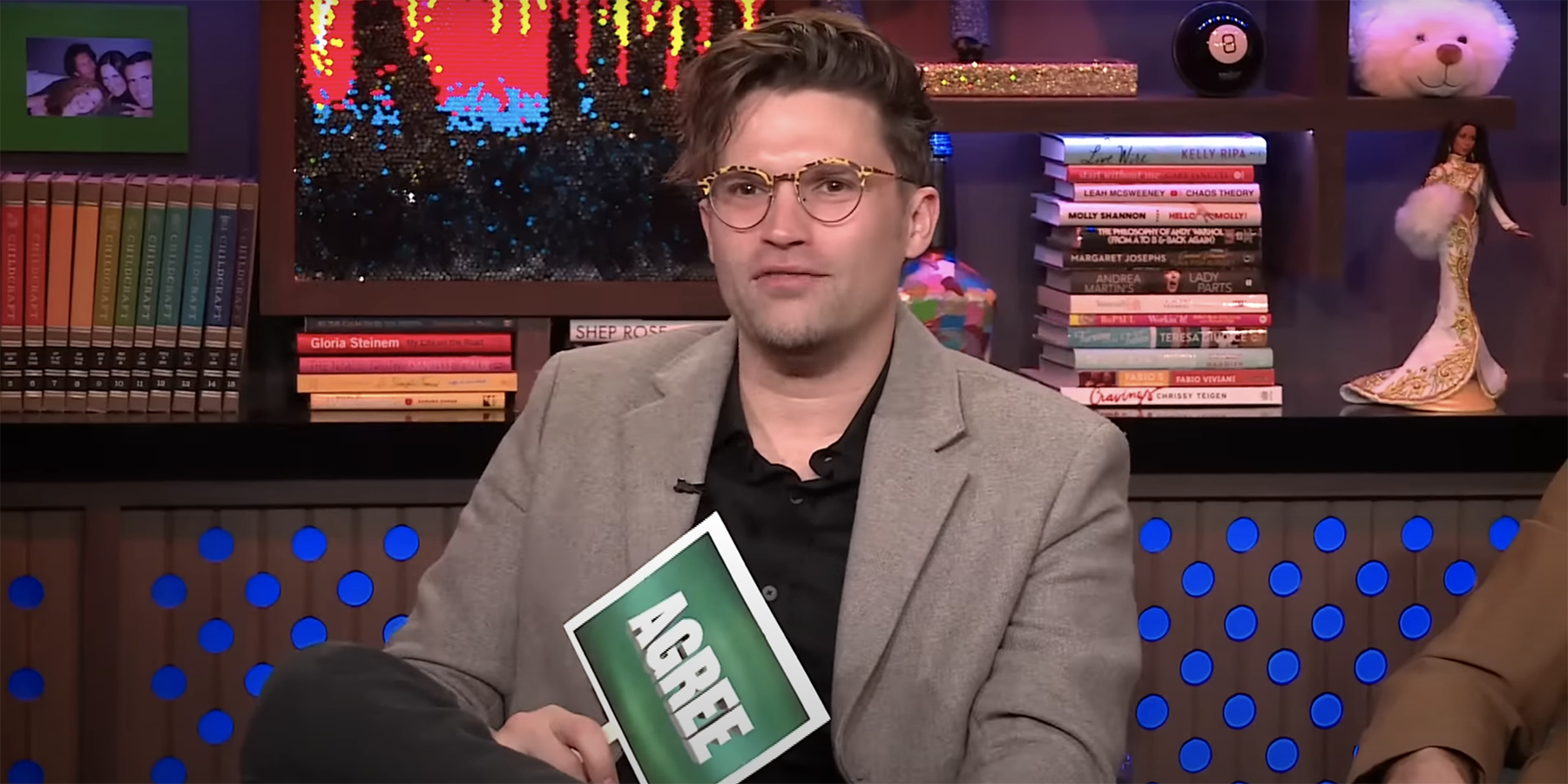 Tom Schwartz from Vanderpump Rules on Watch What Happens Live holding