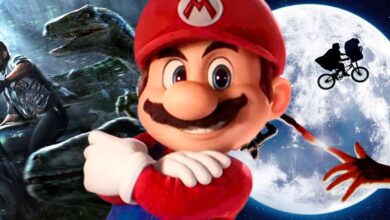 Mario Posing in Front of Jurassic World and ET