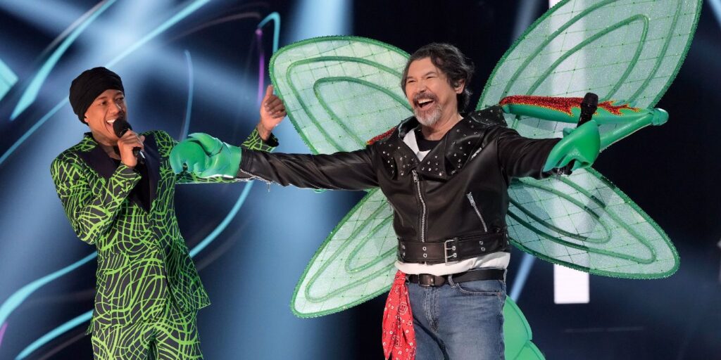 Nick Cannon unmasking Lou Diamond Phillips on The Masked Singer