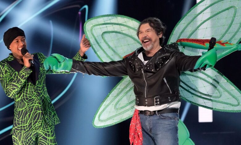 Nick Cannon unmasking Lou Diamond Phillips on The Masked Singer