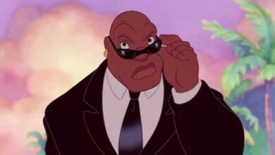 Cobra Bubbles adjusting his sunglasses in Lilo & Stitch