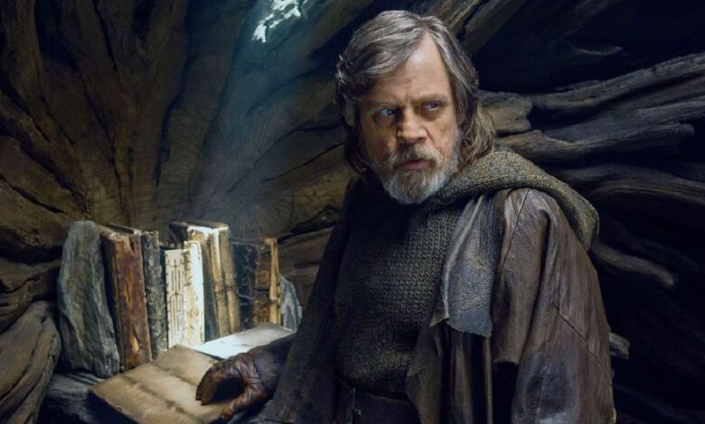 Mark Hamill's Luke Skywalker stands in front of the sacred Jedi texts