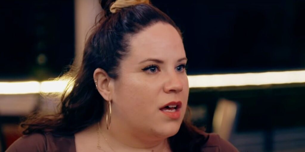 Whitney Way Thore My Big Fat Fabulous Life looking serious wearing hoop earrings