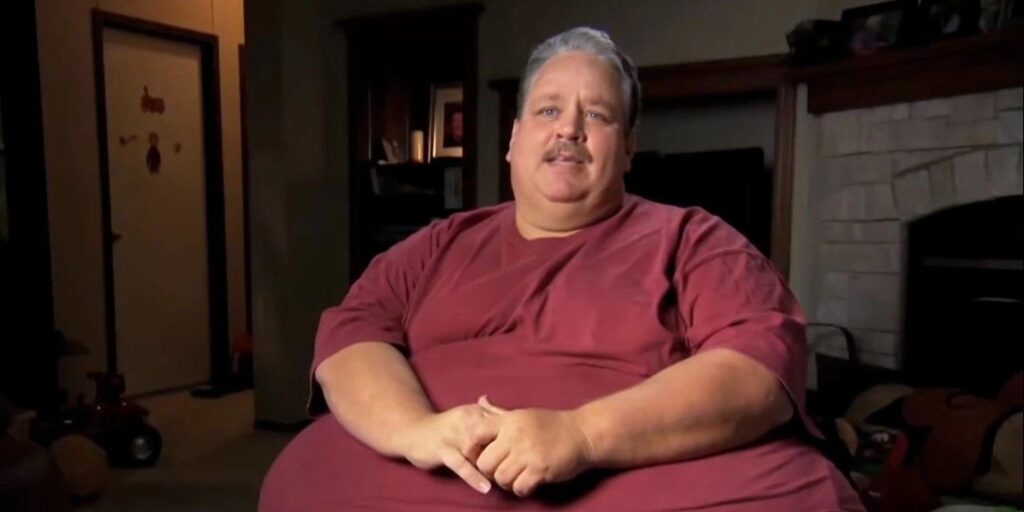 Chuck Turner My 600-Lb Life talking to cameras in dark room