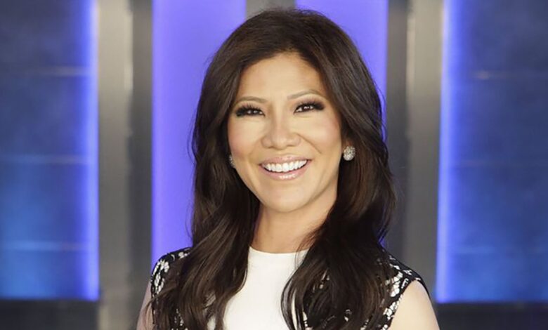 Close up of Big Brother host Julie Chen smiling in front of house
