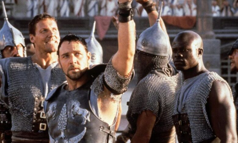 Russell Crowe and Djimon Hounsou in the original Gladiator celebrating a victory in the arena